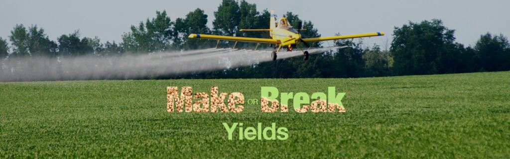 A plane making an aerial fungicide application to a field with the Make or Break Yields text